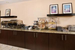 a kitchen with a counter with some food on it at Residence Inn Richmond Northwest in Broad Meadows