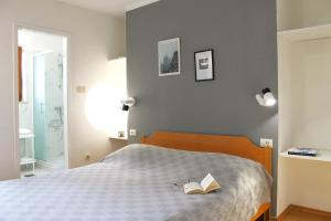 Ein Bett oder Betten in einem Zimmer der Unterkunft Apartments Villa Tre Marie