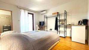 Ein Bett oder Betten in einem Zimmer der Unterkunft Apartments Villa Tre Marie