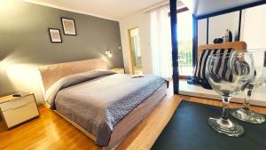 Ein Bett oder Betten in einem Zimmer der Unterkunft Apartments Villa Tre Marie