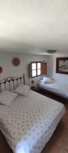 Postel nebo postele na pokoji v ubytování B&B Cortijo Loma León
