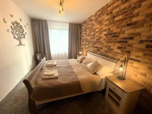 A bed or beds in a room at TATRANSKY DOM sk