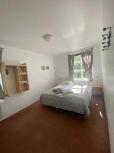 Postel nebo postele na pokoji v ubytování Guesthouse Hraunbaer