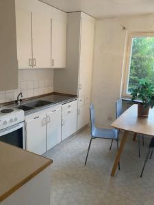 Kuchyň nebo kuchyňský kout v ubytování Cozy apartment + 5 fotografií