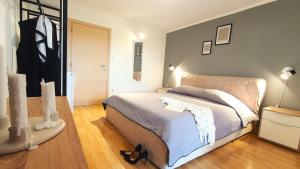 Ein Bett oder Betten in einem Zimmer der Unterkunft Apartments Villa Tre Marie