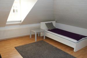 A bed or beds in a room at Kränzlin Hotel