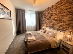 A bed or beds in a room at TATRANSKY DOM sk