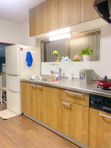 Kuchyň nebo kuchyňský kout v ubytování 小岩民泊宿