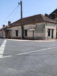 an empty street in front of a building at Maison au Choux Loiret in Les Choux