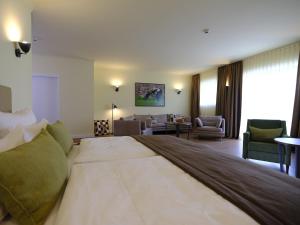 Postel nebo postele na pokoji v ubytování Farmer Hotel Basedow