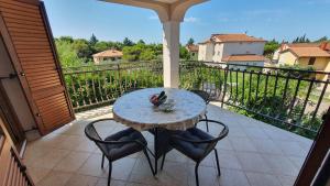 Ein Balkon oder eine Terrasse in der Unterkunft Apartments Villa Tre Marie