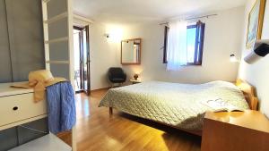 Ein Bett oder Betten in einem Zimmer der Unterkunft Apartments Villa Tre Marie