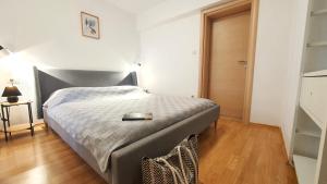 Ein Bett oder Betten in einem Zimmer der Unterkunft Apartments Villa Tre Marie