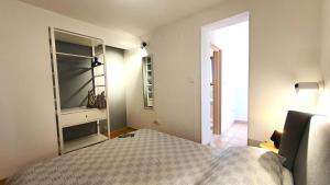 Ein Bett oder Betten in einem Zimmer der Unterkunft Apartments Villa Tre Marie