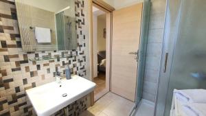 Ein Badezimmer in der Unterkunft Apartments Villa Tre Marie