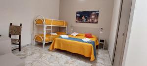 a bedroom with two beds and a bunk bed at Debora Holiday House in Misterbianco