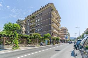 a building on the side of a city street at Mare e Monti a due Passi dalla Spiaggia! Ligurian Vacation Apartment in Chiavari