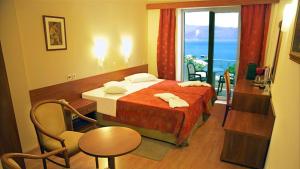Postel nebo postele na pokoji v ubytování Hotel Kiani Akti
