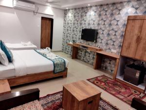 TV a/nebo společenská místnost v ubytování Boshan Hotels