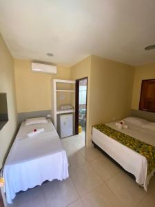 Postel nebo postele na pokoji v ubytování Sol Hostel & Pousada Maragogi