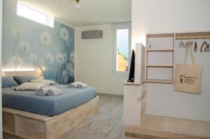 Postel nebo postele na pokoji v ubytování Magazzini Sasso Guest House