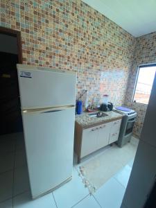 Kuchyň nebo kuchyňský kout v ubytování Sol Hostel & Pousada Maragogi