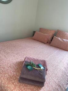 a bed with a tray with a plant on it at MISTRAL Gagnant in Cassis