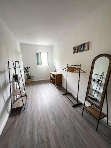 an empty room with a mirror and a dressing table at Revived in Porto da Cruz