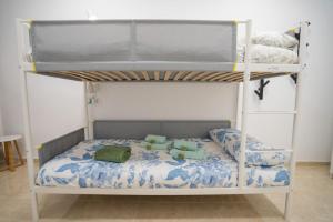a bunk bed with two pillows on it at Casa Rural da Eva in Santa Cruz de Tenerife
