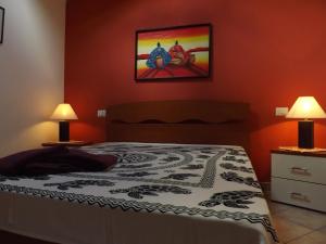 Ένα ή περισσότερα κρεβάτια σε δωμάτιο στο IL Noce ALGHERO