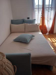 a large bed with two pillows on it in a room at Sea Gargano Home in Poggio Imperiale +27 photos