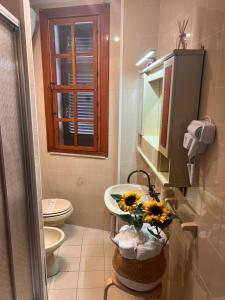 a bathroom with a sink and a toilet at Sea Gargano Home in Poggio Imperiale +27 photos