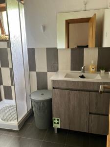 a bathroom with a sink and a toilet and a mirror at Quinta da Meda in Coimbra