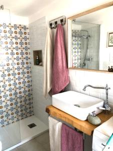 a bathroom with a sink and a shower at Casa Levante in Canosa di Puglia +44 photos