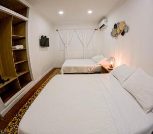 Cama ou camas em um quarto em Puesta del Sol Guest House