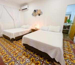 Cama ou camas em um quarto em Puesta del Sol Guest House