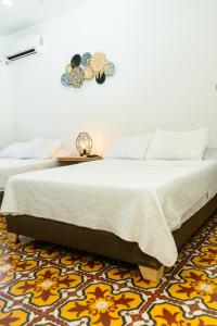 Cama ou camas em um quarto em Puesta del Sol Guest House
