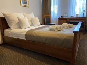 Łóżko lub łóżka w pokoju w obiekcie Hotel Constancja