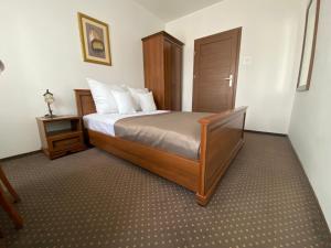 Łóżko lub łóżka w pokoju w obiekcie Hotel Constancja