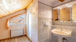 a bathroom with a sink and a window at Villa Panoramique - Lac du Bourget in Bourdeau +62 photos