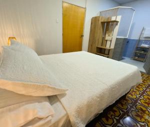 Cama ou camas em um quarto em Puesta del Sol Guest House