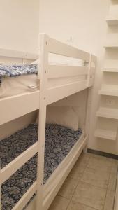 a white bunk bed in a room at Evesea in Francavilla al Mare