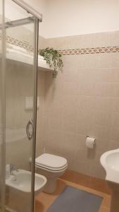 a bathroom with a toilet and a sink at Evesea in Francavilla al Mare