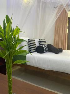 Postel nebo postele na pokoji v ubytování Cozy Homestay Waterfall Road Ella