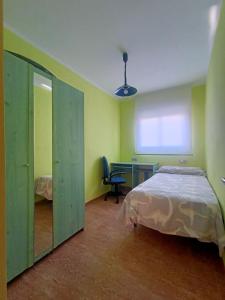 Postel nebo postele na pokoji v ubytování Hospedaje casaAlfredo