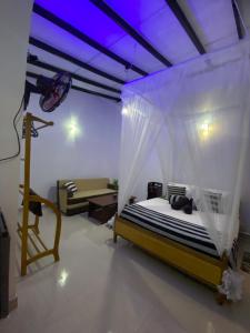 Postel nebo postele na pokoji v ubytování Cozy Homestay Waterfall Road Ella