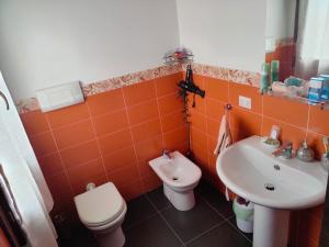 a bathroom with a toilet and a sink at B&B Nuovo Capo Altano in Portoscuso +64 photos