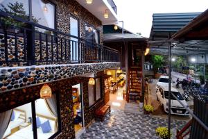 an outside view of a building with a balcony at Mai Châu Homestay 88 in Mai Chau