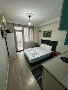 Postel nebo postele na pokoji v ubytování AWWA APART HOTEL