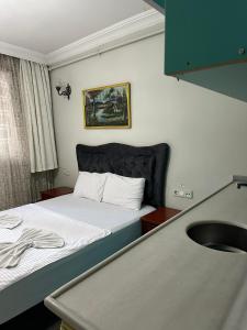 Postel nebo postele na pokoji v ubytování AWWA APART HOTEL